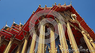 Gorgeously crafted Thai temple with golden columns Stock Photo