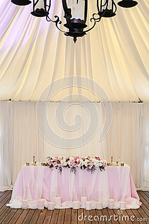 Gorgeously decorated newlyweds table with monogram under it Stock Photo