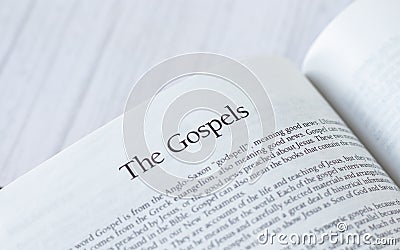 The gospels message, open Holy Bible Book isolated on white background, a closeup Stock Photo