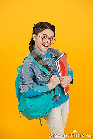 Got homework done. Playful girl hold school bag and books. Homework assignment. Home schooling. Homework club Stock Photo
