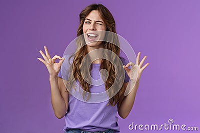 Got it relax everything perfect. Relaxed carefree curly girl winking cheeky smiling cunning show okay ok ring sign Stock Photo
