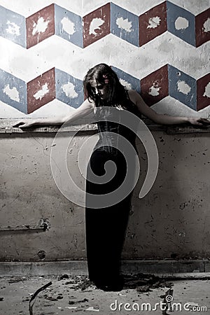 Goth girl against painted wall Stock Photo