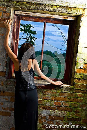 Goth girl at window Stock Photo