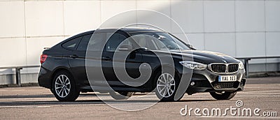 Black 2015 BMW 320D Xdrive car on a parking lot.. Editorial Stock Photo
