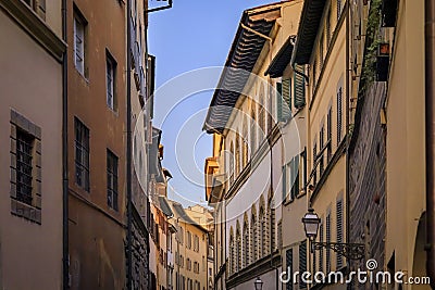 Gothic buildings on a narrow street in Centro Storico of Florence, Italy Stock Photo