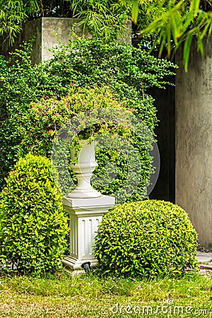 Gothic flower pot in garden. Stock Photo