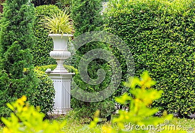 Gothic flower pot in garden. Stock Photo