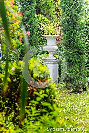 Gothic flower pot in garden. Stock Photo