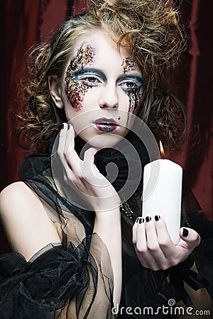 Gothic portrait of woman with candle. Stock Photo