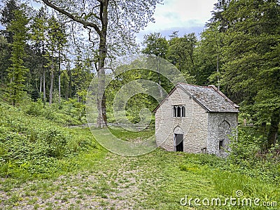 Gothic pumphouse and pond Stock Photo