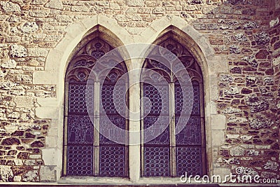 Gothic symmetrical windows with vintage treatment Stock Photo