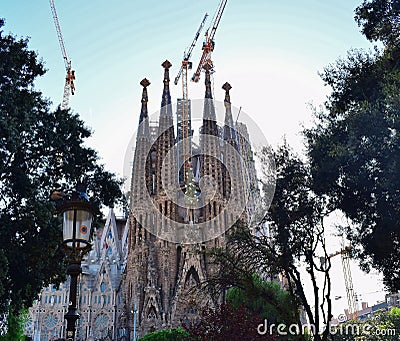 Gothic temple with high towers and different facades. Editorial Stock Photo