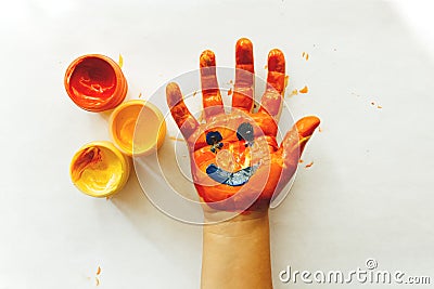 Gouache drawing on a childs hand Stock Photo