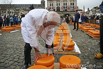Gouda - Netherlands -2022 - start of the touristic cheese market with children and old farmers and cheesemakers to demontrate Editorial Stock Photo
