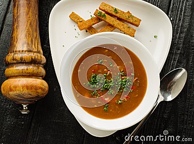 Goulash soup with beans, bell peppers and garlic croutons. Top v Stock Photo