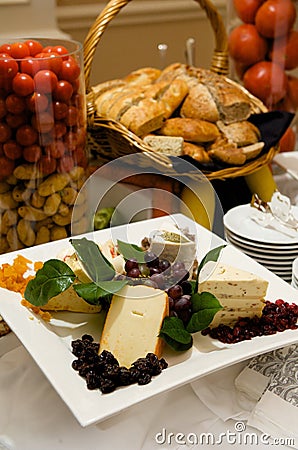 Gourmet cheese plate with garnishes Stock Photo
