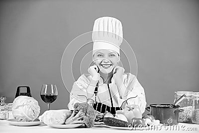 Gourmet cuisine is served here. Happy cook cooking delicious cuisine with vegetarian food. Sexy chef smiling with Stock Photo