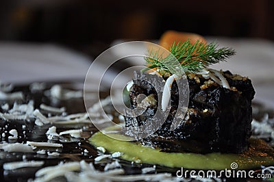 Gourmet design Italian food. Squid artichoke flan Stock Photo