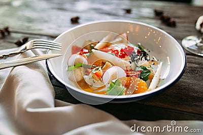 Gourmet dish with caviar salmon sauce vegetables Stock Photo