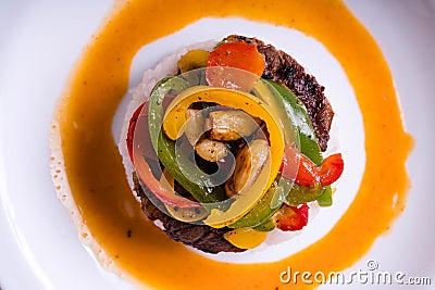 Garlic bell pepper with rib eye steak on hot cheese mayo sauce Stock Photo