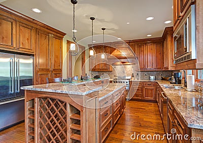 Gourmet kitchen boasts maple cabinetry Stock Photo