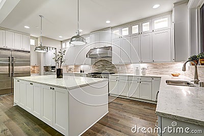 Gourmet kitchen features white cabinetry Stock Photo