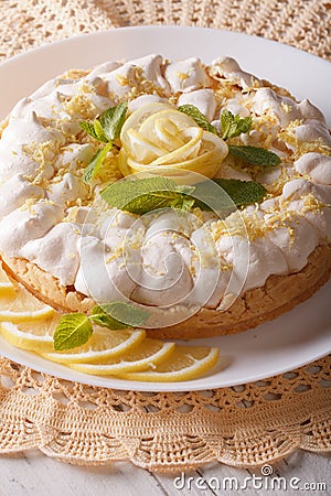 Gourmet Lemon cake with meringue and mint close-up. Vertical Stock Photo