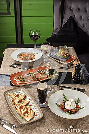 Gourmet meals assorted set appetizer tartare, barrata, pasta on the table Buffet at restaurant Stock Photo
