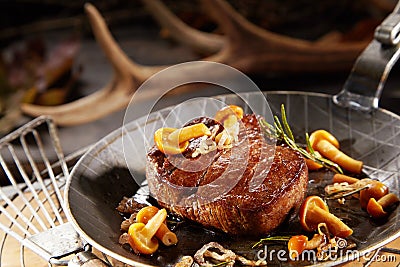 Gourmet thick marinated grilled wild venison steak Stock Photo