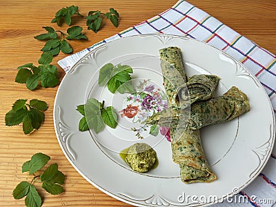 Goutweed green omelet on plate, organic food Stock Photo