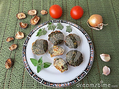 Goutweed omelette with mushrooms shiitake on plate Stock Photo