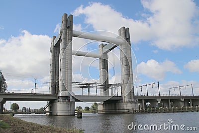 Gouwespoor vertical lifting bridge over canal Gouwe at Gouda for trains in the Netherlands. Editorial Stock Photo