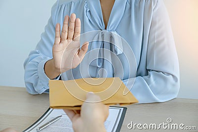 Government officials hand refused to accept bribes from the businessmen offer for signing in a contract of business project, Stock Photo