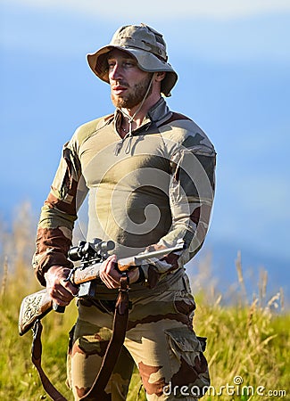 Government Surveillance. weapon permit. hunter in camouflage. security of democracy. defender of motherland. man with Stock Photo