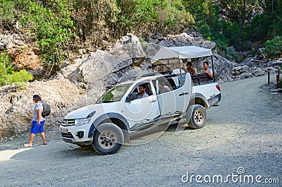 Tourists ride in car along mountain road in Goynuk Canyon, Turkey Editorial Stock Photo