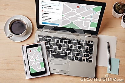 GPS map navigation app on laptop and smartphone screen. Location Stock Photo