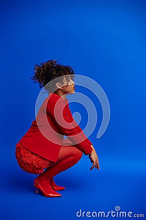 graceful trendy african american fashionista in Stock Photo