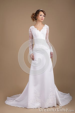Graceful Young Bride in Wedding Dress Stock Photo