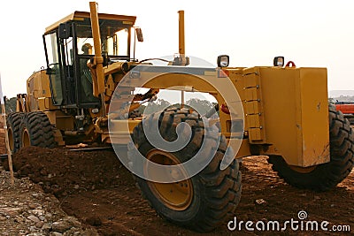 Grader scraping Stock Photo