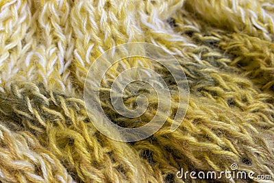 Gradient knitted background. Lemon coloured alpaca and wool threads with beautiful knitting pattern. Gradient crochet Stock Photo