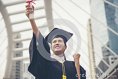 Graduate Student and Success Education in University Concept. Happy Asian student woman graduate diploma and MBA degree in asian Stock Photo