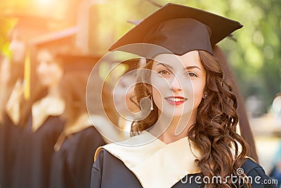 Graduate students wearing graduation hat and gown Stock Photo