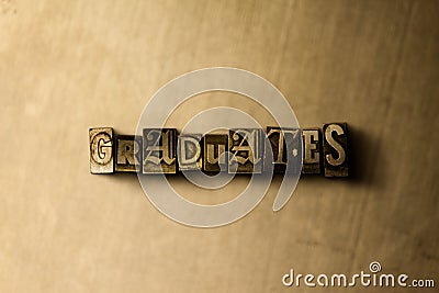 GRADUATES - close-up of grungy vintage typeset word on metal backdrop Cartoon Illustration