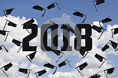 Graduation 2018 black hats in sky with clouds Stock Photo