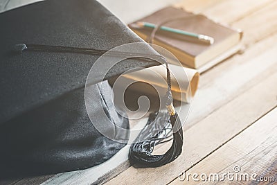 graduation cap, hat with degree paper on wood table graduation c Stock Photo