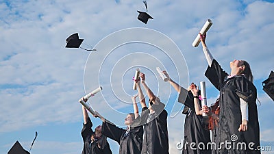 Graduation Caps Thrown in the Air. Stock Photo