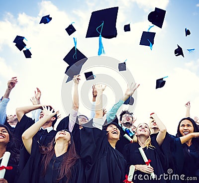 Graduation Caps Thrown in the Air Stock Photo