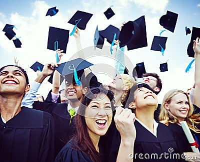 Graduation Caps Thrown in the Air Stock Photo