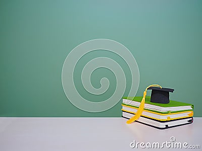 Graduation hat on stack hardcover book, Copy space for text, Back to school, Education concept Stock Photo
