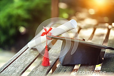 Graduation hat with tassel, diploma with red Stock Photo